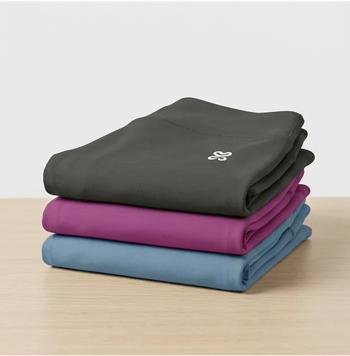 Collage of purple shorts with a logo, folded clothes, and fabric texture on a white background.